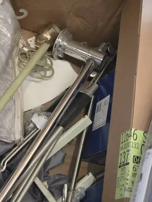 Plumbing and Home Improvement Items including Delta Faucet, Curtain Rods, and Shower Curtain - Conditions Untested