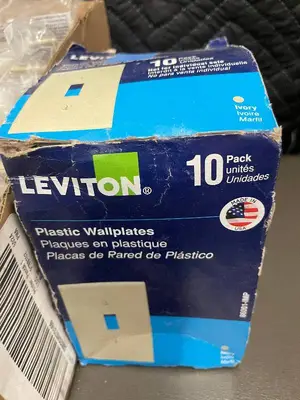 Box of 10 Leviton Ivory Nylon Midway Wallplates and box of Plastic wallplates.