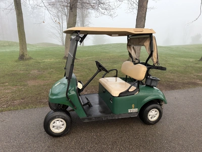 (1) 2015 E-Z-Go golf cart with a Kawasaki gas engine, includes canopy, ball cover, club cover, fold-...