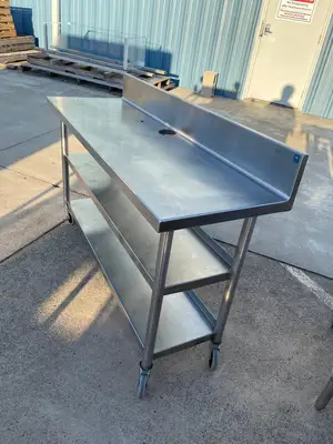 Used Falcon Restaurant Supply Used 60"x20" Heavy Stainless Table with Shelves, Casters and 6" Backsplash JD - SS323 Food Prep Tables Illinois US | Falcon Restaurant Supply #1375164