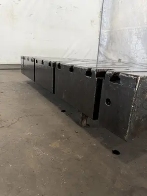 60" WIDE X 67" LONG X 9" THICK T-SLOTTED BOLSTER PLATE. STOCK # 1006324