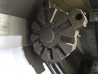 Hyundai SKT-400C F21ITB CNC Lathe w/ Tailstock and Indexer, 10 Slot Turret, LNS Conveyor, 3-Jaw