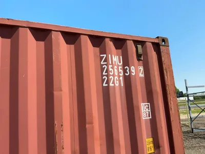20’ Shipping / Storage Container 8’ wide x 8’ 6” tall, swing doors on one end, wood deck, rings for ...
