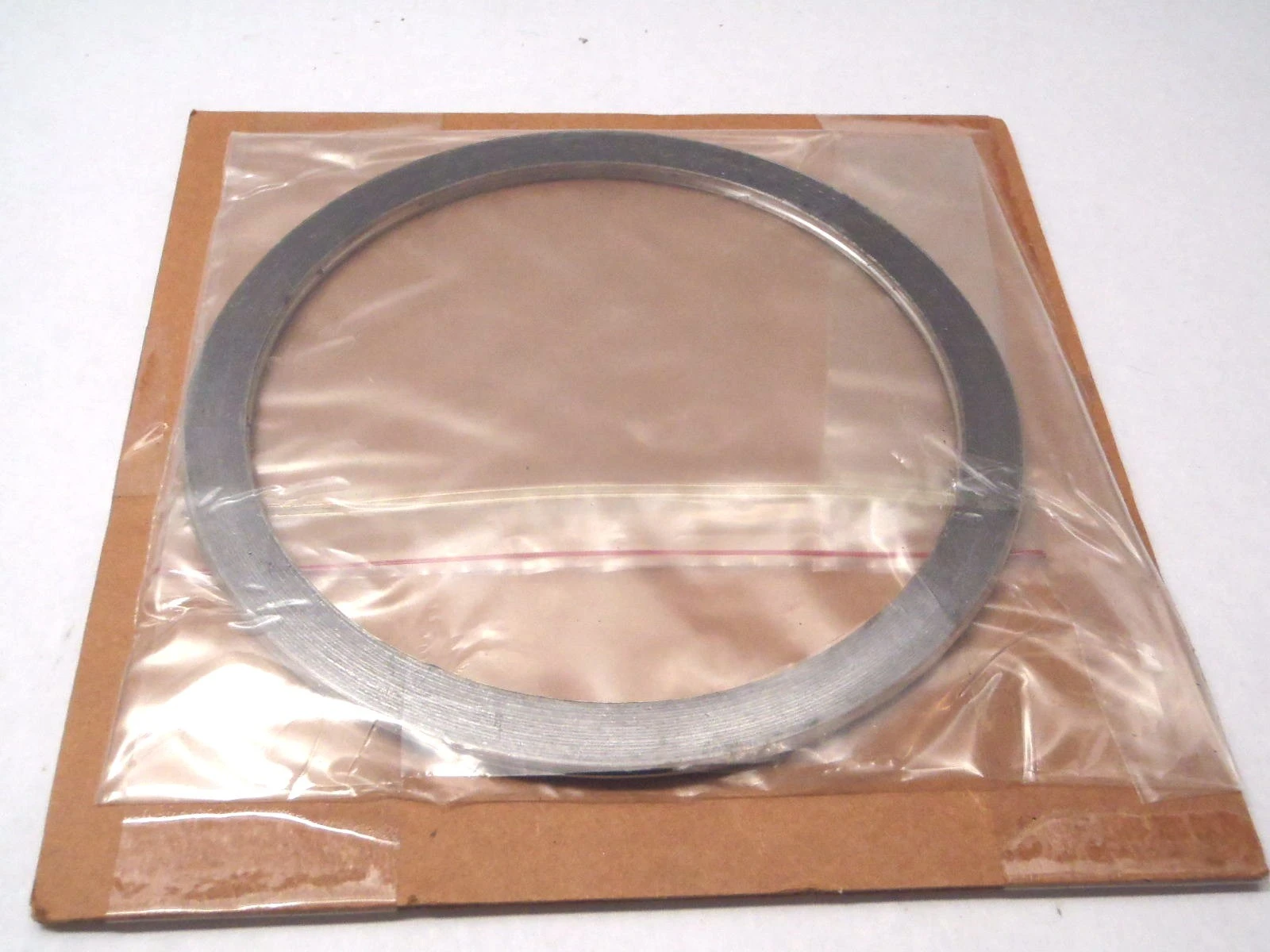 USED FLEXITALLIC HANDHOLE GASKET SEAL 6-1/16" ID X 7-3/16" OD X .1750" THICK