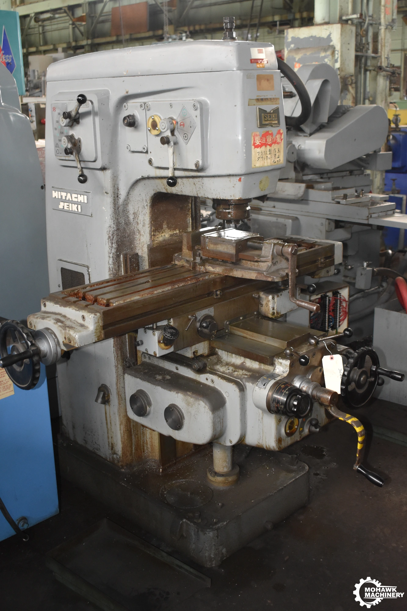 MS-V HITACHI-SEIKI VERTICAL MILL w/POWER DOWN FEED - FRONT & REAR CONTROLS - 10.5” X 43.5” TABLE - VISE