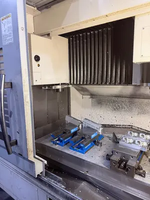 USED 2011 OKUMA GENOS 560V