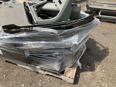 Skid of Kenworth interior parts including dash panels and sleeper cab components, used