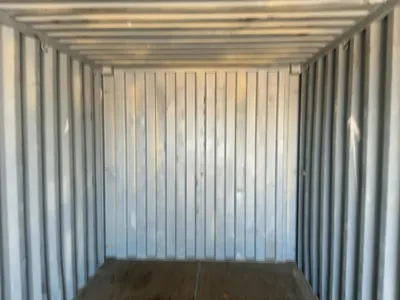 20’ Shipping / Storage Container 8’ wide x 8’ 6” tall, swing doors on one end, wood deck, rings for ...