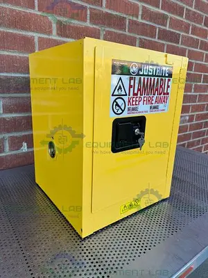 USED JUSTRITE 4 GALLON FLAMMABLE LIQUID STORAGE CABINET W/ SOFT CLOSE DOORS, KEY