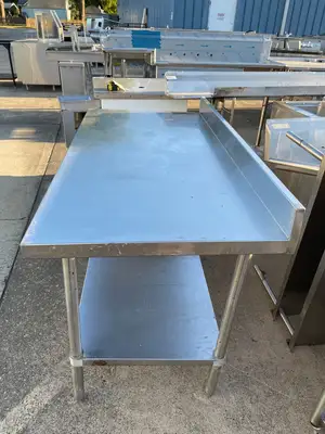 Used Regency Used Regency 30"X60" Stainless Steel Table with Shelf and 4" Backsplash JD - SS322 Food Prep Tables Illinois US | Falcon Restaurant Supply #1375170
