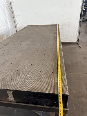 50" X 124" DRILLED & TAPPED STEEL LAYOUT TABLE W/ STAND. STOCK # 0667025.