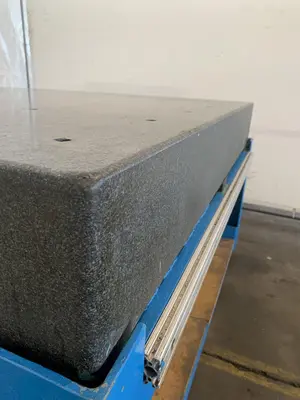 60" X 60" X 8-1/4" GRANITE SURFACE TABLE. STOCK # 1165023.