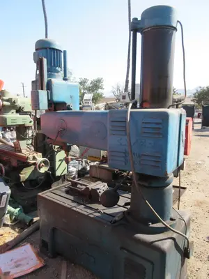 Caser, radial arm drill press