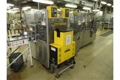 Douglas case packer with controls and magazine