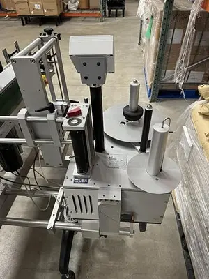 Quadrel model Moduline pressure sensitive wraparound labeler