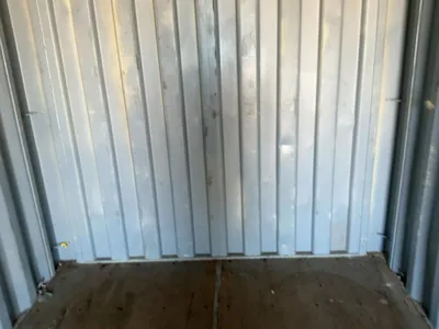 20’ Shipping / Storage Container 8’ wide x 8’ 6” tall, swing doors on one end, wood deck, rings for ...