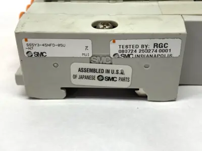 USED SMC PNEUMATIC MANIFOLD ASSEMBLY 5 STATIONS 1/4" PORTS 24VDC