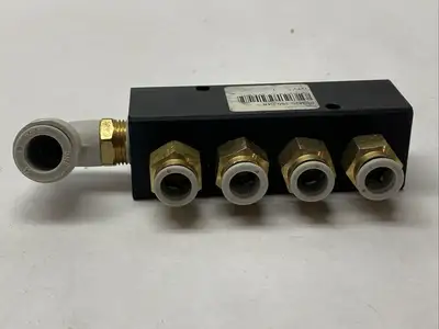 PCM20-250-04B | Polyconn  Pneumatic Manifold, 4x 1/4" NPT Out , 3/8"NPT IN - Used