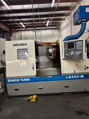 1999 OKUMA LB-400M CNC Turning Centers, Horizontal CNC Turning / Live Milling | Machinery Management (1)