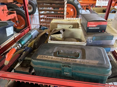 (1) small wire shelf with assorted contents, includes Dremel tool, small battery charger, pneumatic ...