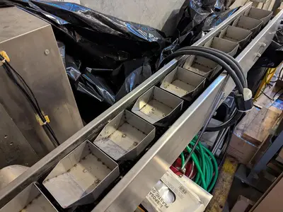 Flow Packer with Bucket Infeed