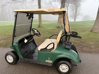 (1) 2015 E-Z-Go golf cart with a Kawasaki gas engine, includes canopy, ball cover, club cover, fold-...