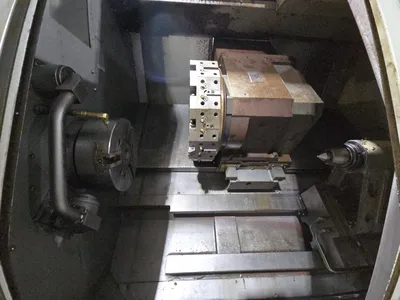 Hyundai SKT-300 CNC Lathe w/ Tailstock and Indexer, 10 Slot Turret, LNS Conveyor, 3-Jaw Chuck, Fanuc