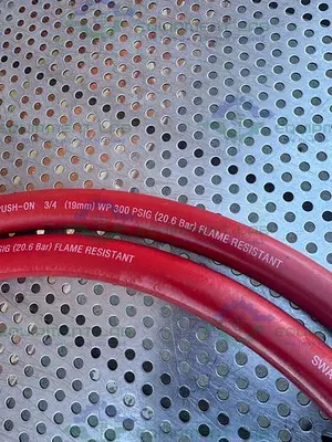 USED SWAGELOK PUSH ON 124" FLAME RESISTANT HOSE 3/4” 300PSIG W/ QUICK RELEASE FITTING