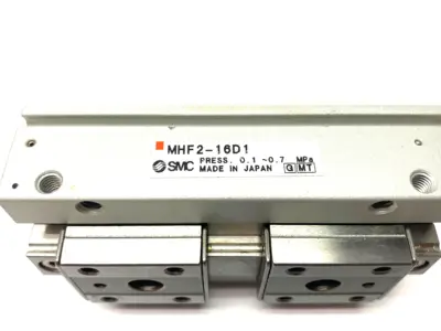 USED SMC LOW-PROFILE PNEUMATIC GRIPPER, 2-FINGER, 16MM STROKE PER JAW