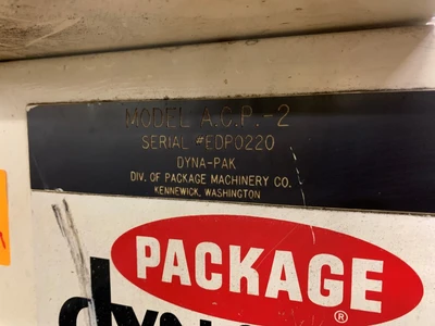 Dyna Pak A.C.P. - 2 vertical case packer w/ programmable control