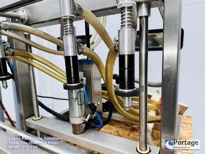 USED 2010 LIQUID PACKAGING 310-150 TT OVERFLOW FILLER