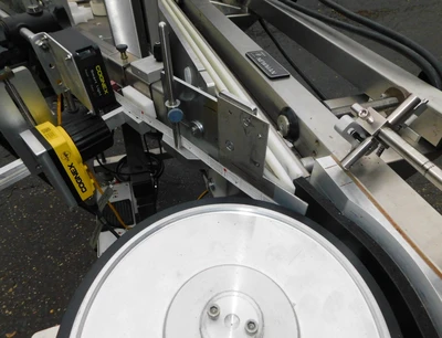 USED NEWMAN WRAP AROUND LABELER NV II