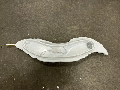 White and gold feather wall sconce