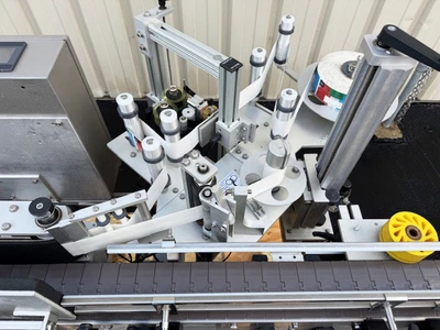 In-Line Packaging Wrap Around Pressure Sensitive Labeler