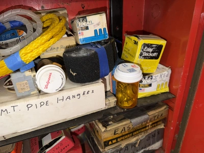 (2) Auto Call single door storage cabinets filled with assorted electrical items, including Push Mat...