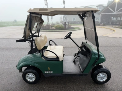 (1) 2015 E-Z-Go golf cart with a Kawasaki gas engine, includes canopy, ball cover, club cover, fold-...