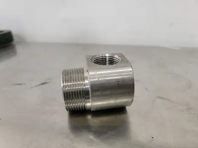 1" Female to 1.5" Male 90 Degree Elbow Hydraulic Adapter