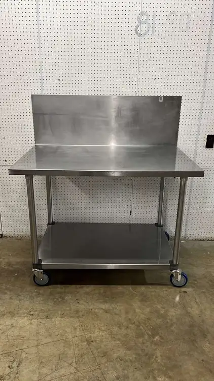 Used Falcon Restaurant Supply Used 48"x 30" Stainless Steel Table with Casters and a 16" Backsplash - FG Food Prep Tables Illinois US | Falcon Restaurant Supply #1374938