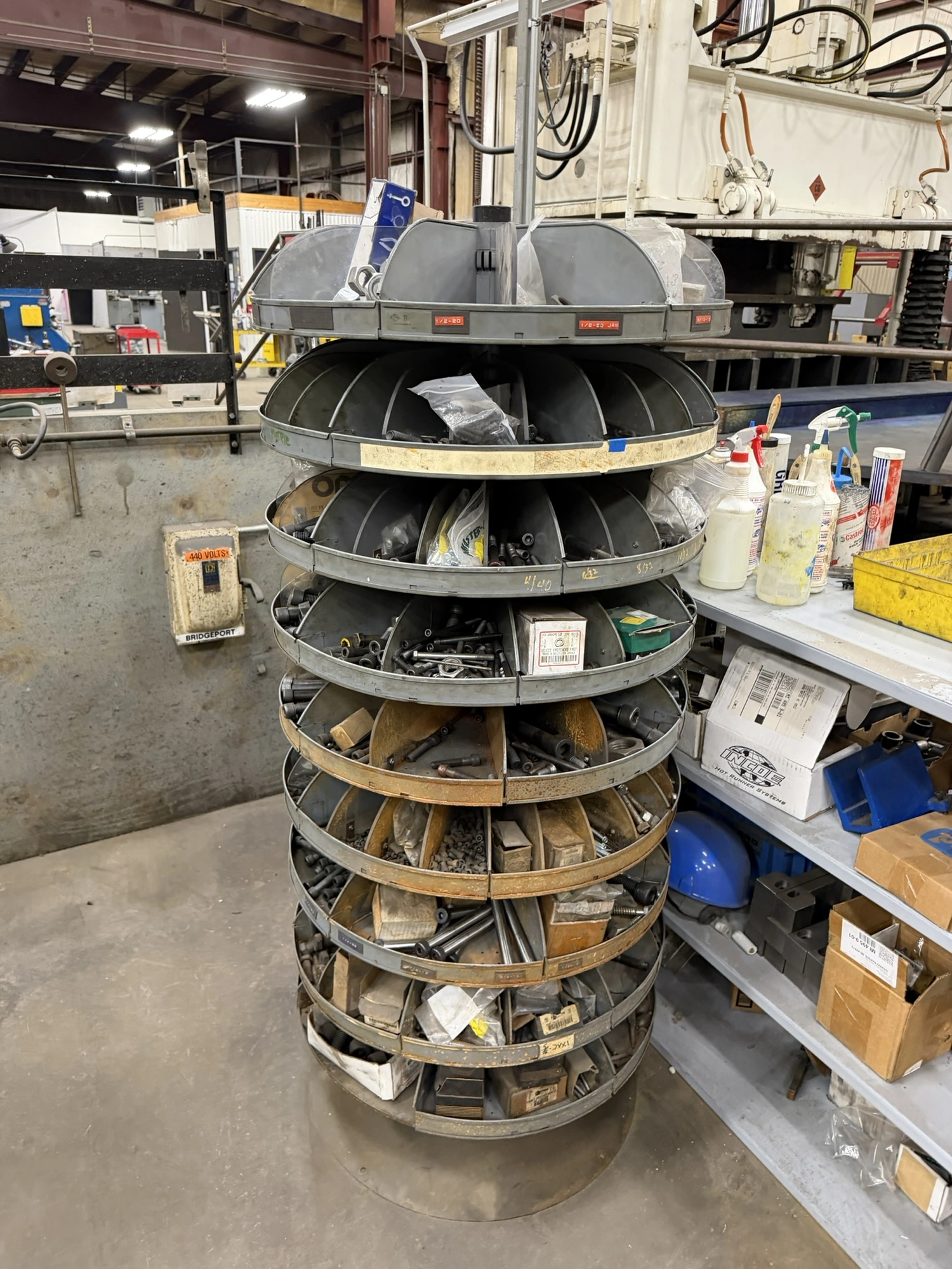 (1) 7-tier lazy Susan style parts rack, approx. 66" tall, includes assorted socket head cap screws, ...
