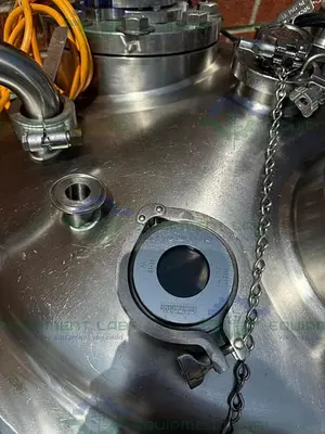 USED PRECISION 250 LITER STAINLESS STEEL JACKETED REACTOR 45 PSI W/ LIGHTNIN MIXER.