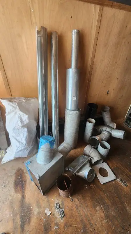 Various HVAC Ductwork Pieces and Accessories including Pipe, Elbows, and Connectors