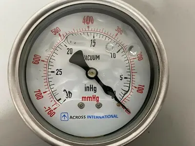 USED ACROSS INTERNATIONAL STAINLESS STEEL VACUUM GAUGE W/ 1/2" CONNECTION