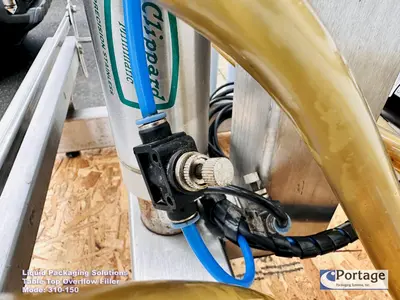 USED 2010 LIQUID PACKAGING 310-150 TT OVERFLOW FILLER