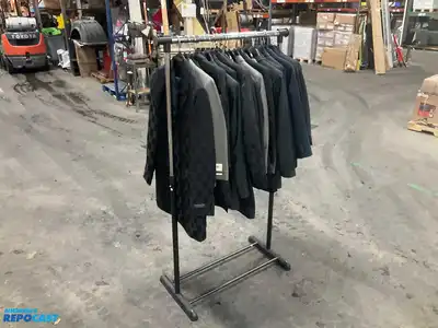Lot of (21) assorted size youth suit coats and rack