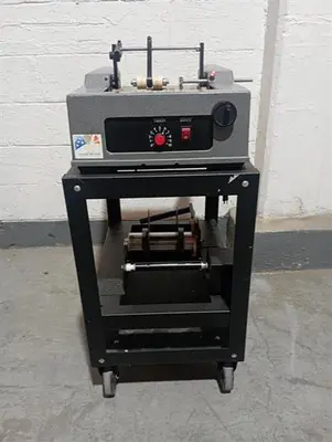 Advent model 310 semi-automatic pressure sensitive wraparound labeler