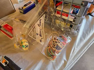 Assorted Office and Craft Supplies including Giant Pencil Decor, Cable Organizer, Glue Stic Foam Cushion Roll, and Miscellaneous Tools