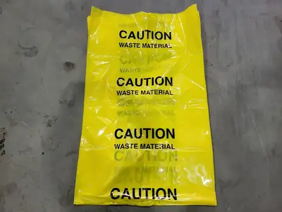 Caution Waste Material Yellow Bag 4-mil 30" x 48" (Box of 45)
