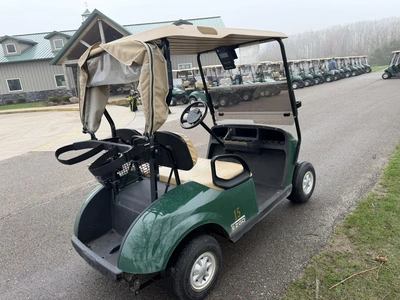 (1) 2015 E-Z-Go golf cart with a Kawasaki gas engine, includes Club canopy, ball washer, fold-down w...