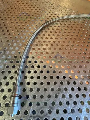 Used SWAGELOK SS-4CP4-10 CHECK VALVE W/ 42" STAINLESS STEEL BRAIDED HOSE 3/4" TO 1/2" Hoses California US | Equipment Lab #1427415