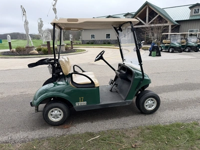 (1) 2015 E-Z-Go golf cart with a Kawasaki gas engine, does not include Club canopy, includes ball wa...